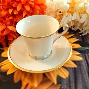 Lenox China eternal pattern cup and saucer. Bone color with gold trim.